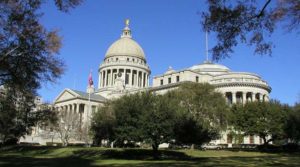 The Mississippi State Capitol building under a clear sky.