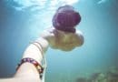 Underwater selfie of a person wearing a snorkeling mask.