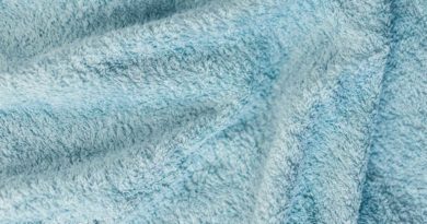 Close-up of soft, light blue fabric texture.