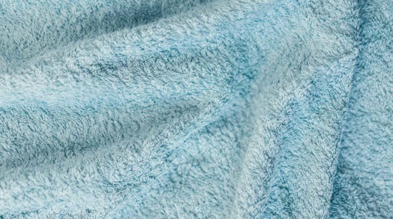 Close-up of soft, light blue fabric texture.