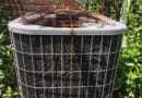 Rusty air conditioning unit with visible corrosion on top grille.