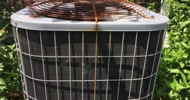 Rusty air conditioning unit with visible corrosion on top grille.
