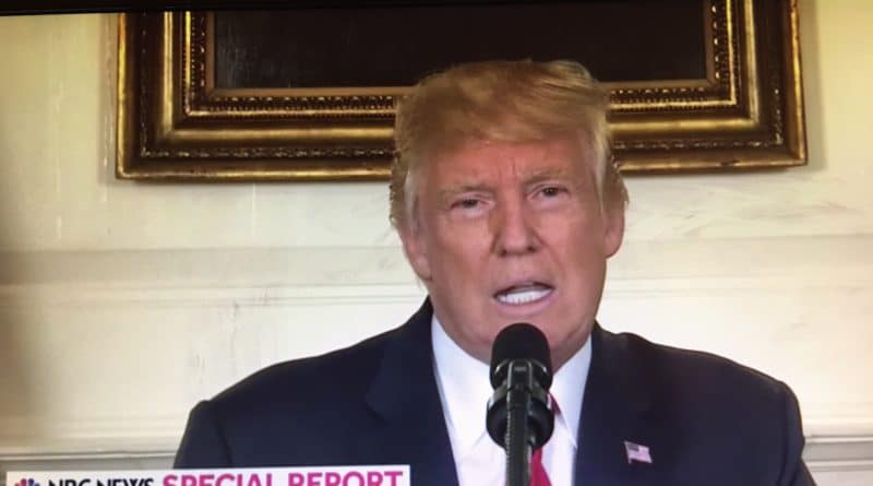 Donald Trump speaking at a podium during a news report.
