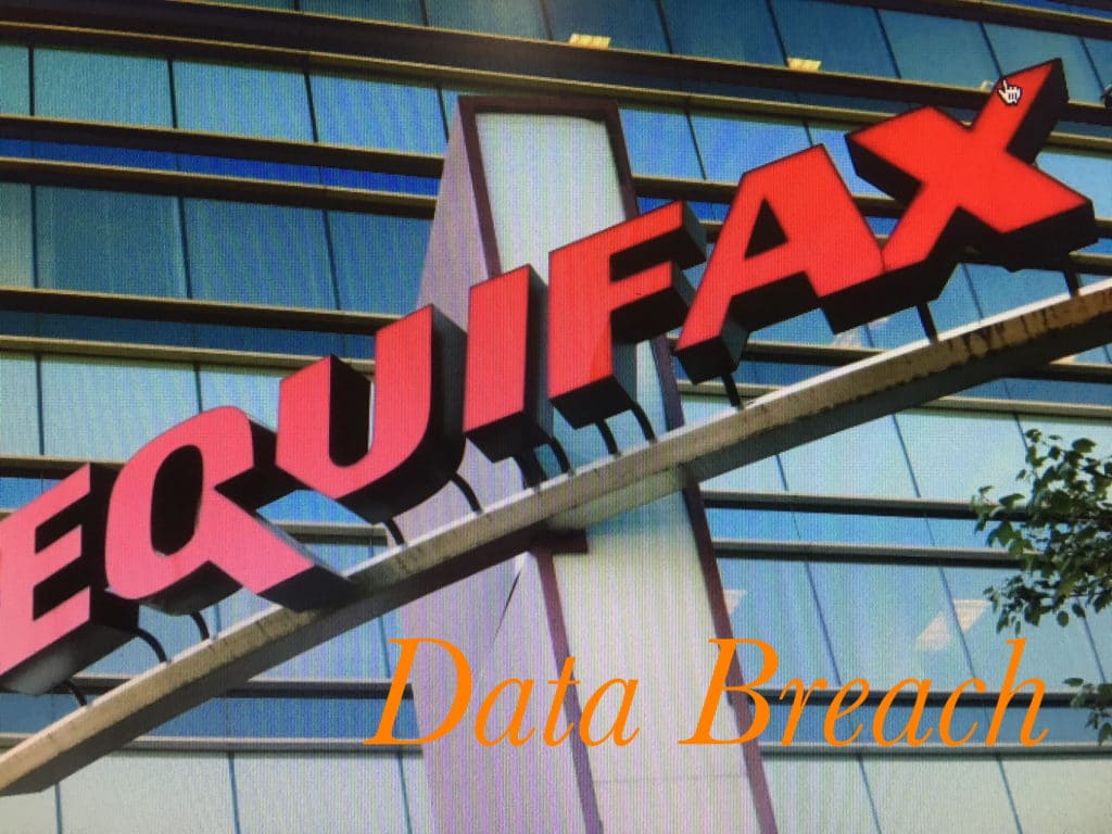 Equifax building sign with reflective glass windows.