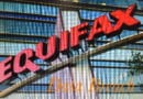 Equifax building sign with reflective glass windows.