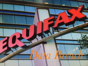 Equifax building sign with reflective glass windows.