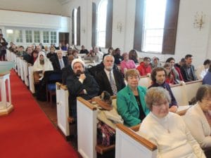 Congregation gathered inside a church during a service.
