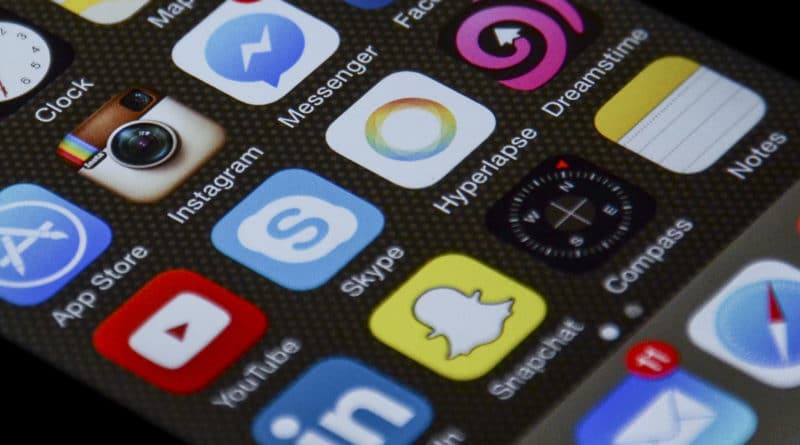 Close-up of a smartphone screen displaying social media and communication app icons.