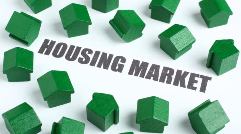 Green house models around 'Housing Market' text.