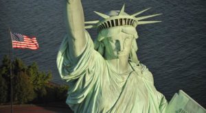 Close-up of the Statue of Liberty's face and crown at dusk.