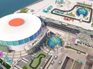 Aerial view of a large sports arena with surrounding parking and roads.