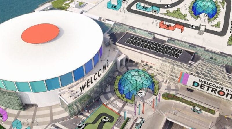 Aerial view of a large sports arena with surrounding parking and roads.