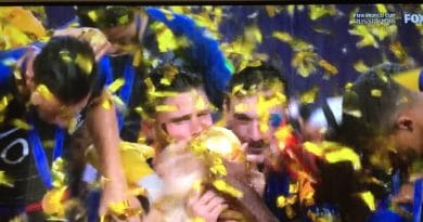 Athletes celebrate victory amid golden confetti.