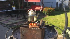 The illuminated facade of Al-Ajami Restaurant at night.