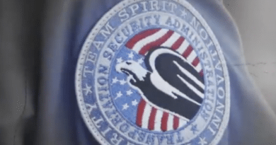 TSA agent's uniform patch with patriotic eagle and flag design.