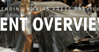 Models showcasing elegant evening gowns on a runway during a fashion show.