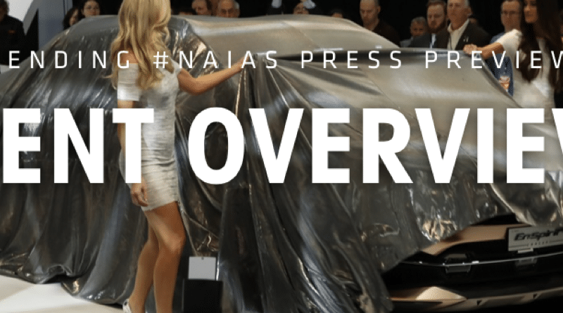 Models showcasing elegant evening gowns on a runway during a fashion show.