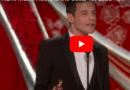 Man accepts Oscar for lead role with gratitude on stage.