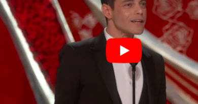 Man accepts Oscar for lead role with gratitude on stage.