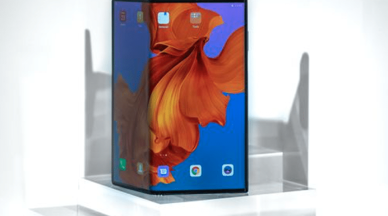 A modern foldable smartphone with a vibrant display on a white stand.