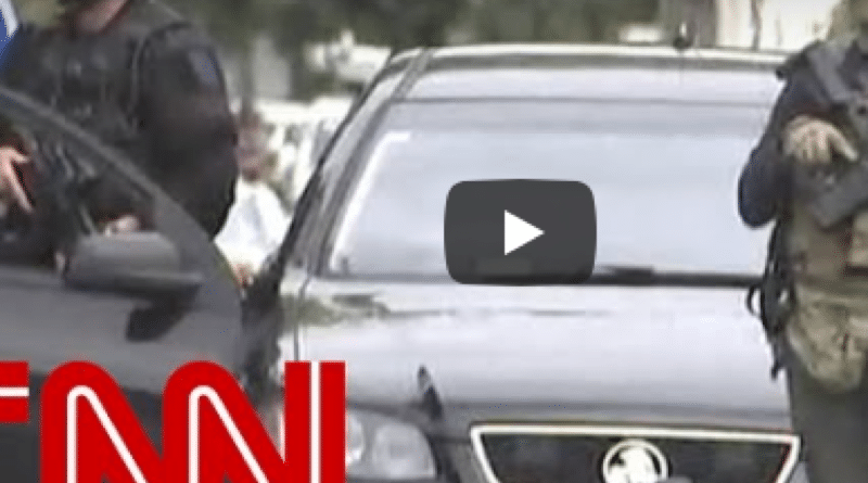 CNN report on New Zealand terrorist attacks with armed police presence.