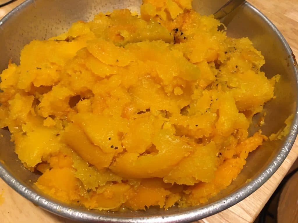 The illuminated facade of Al-Ajami Restaurant at night.