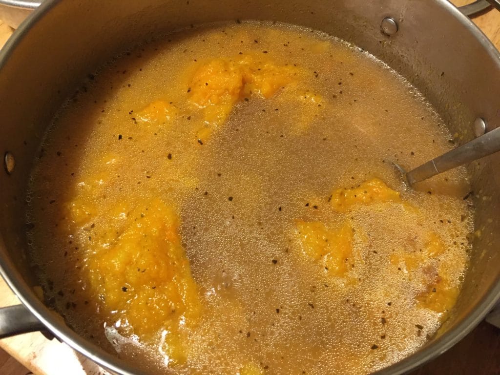 The illuminated facade of Al-Ajami Restaurant at night.