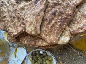 The illuminated facade of Al-Ajami Restaurant at night.