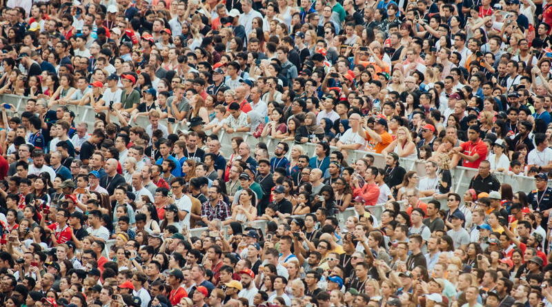 A massive crowd of people densely packed together.