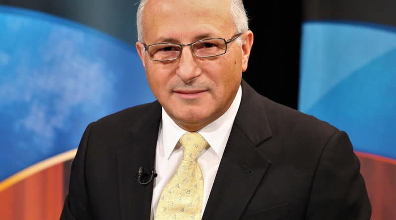 Professional man in suit and tie with glasses.