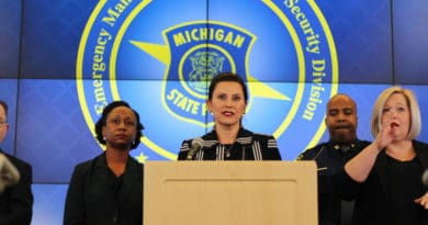 Three officials at a Michigan Department of Homeland Security press conference.