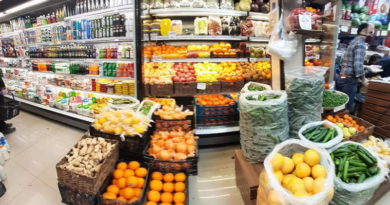 A vibrant market stall filled with fresh fruits and vegetables.