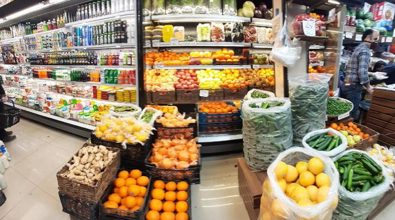 A vibrant market stall filled with fresh fruits and vegetables.