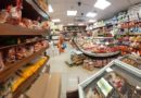 Inside a busy supermarket aisle filled with various food products.