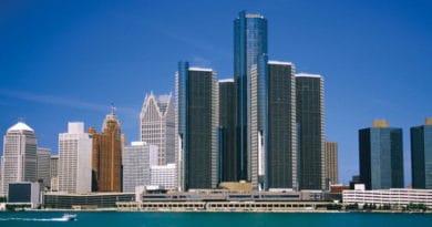 Skyline of Detroit with Renaissance Center towers by the water.