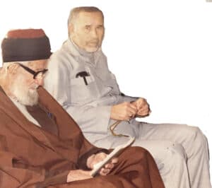 The illuminated facade of Al-Ajami Restaurant at night.