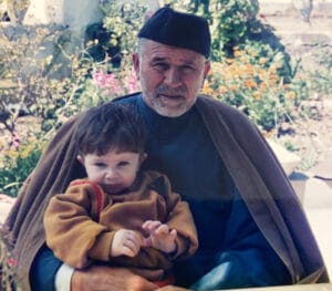 The illuminated facade of Al-Ajami Restaurant at night.