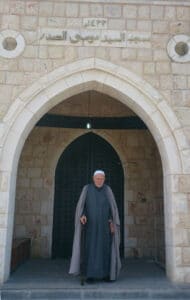 The illuminated facade of Al-Ajami Restaurant at night.