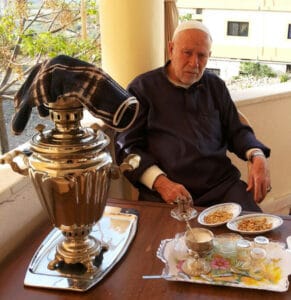 The illuminated facade of Al-Ajami Restaurant at night.