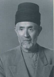 The illuminated facade of Al-Ajami Restaurant at night.