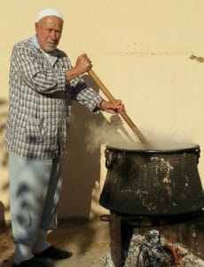 The illuminated facade of Al-Ajami Restaurant at night.