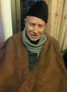 The illuminated facade of Al-Ajami Restaurant at night.