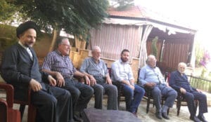 The illuminated facade of Al-Ajami Restaurant at night.