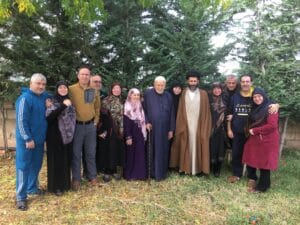 The illuminated facade of Al-Ajami Restaurant at night.