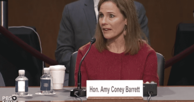 Amy Coney Barrett speaking at a hearing.
