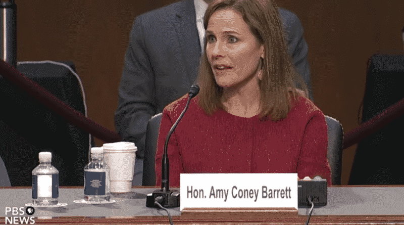 Amy Coney Barrett speaking at a hearing.