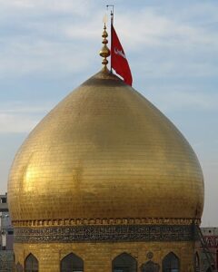 The illuminated facade of Al-Ajami Restaurant at night.