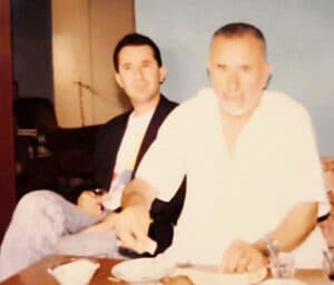The illuminated facade of Al-Ajami Restaurant at night.