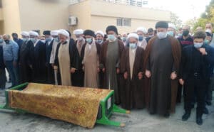 The illuminated facade of Al-Ajami Restaurant at night.