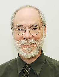 The illuminated facade of Al-Ajami Restaurant at night.